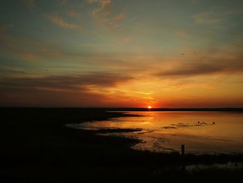 Scenic view of sea at sunset