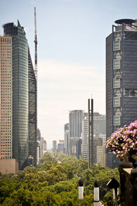 Modern buildings in city against sky