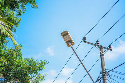 Low angle view of street light against sky