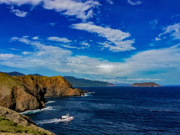 Scenic view of sea against blue sky