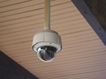 Close-up of security camera on ceiling