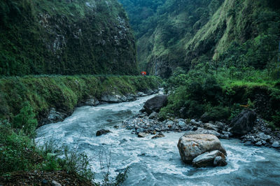 Stream flowing through rocks 