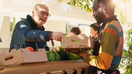 Side view of man working at table