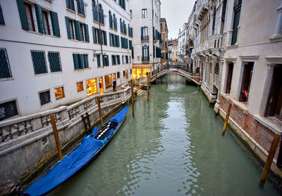 High angle view of gondola moored in canal