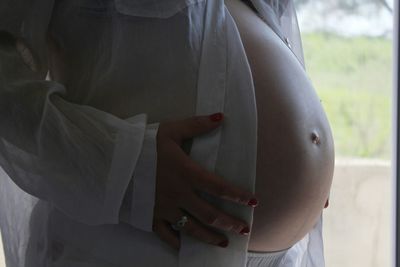 Close-up of midsection of pregnant woman