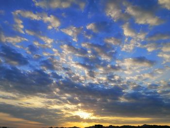 Low angle view of dramatic sky during sunset