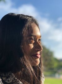 Close-up of young woman looking away 