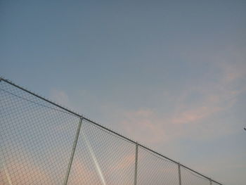 Low angle view of power lines against sky