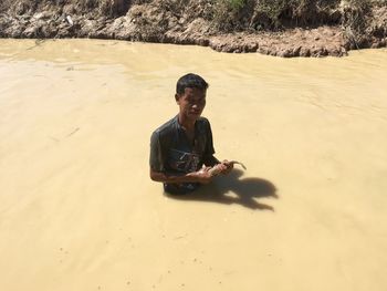 Boy playing on beach