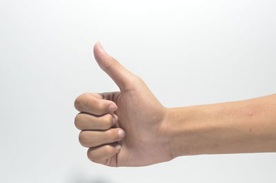 Midsection of person making face against white background