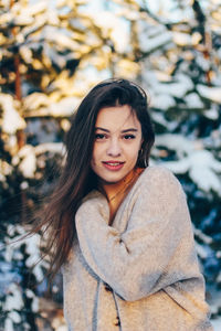 Portrait of young woman in at forest during winter