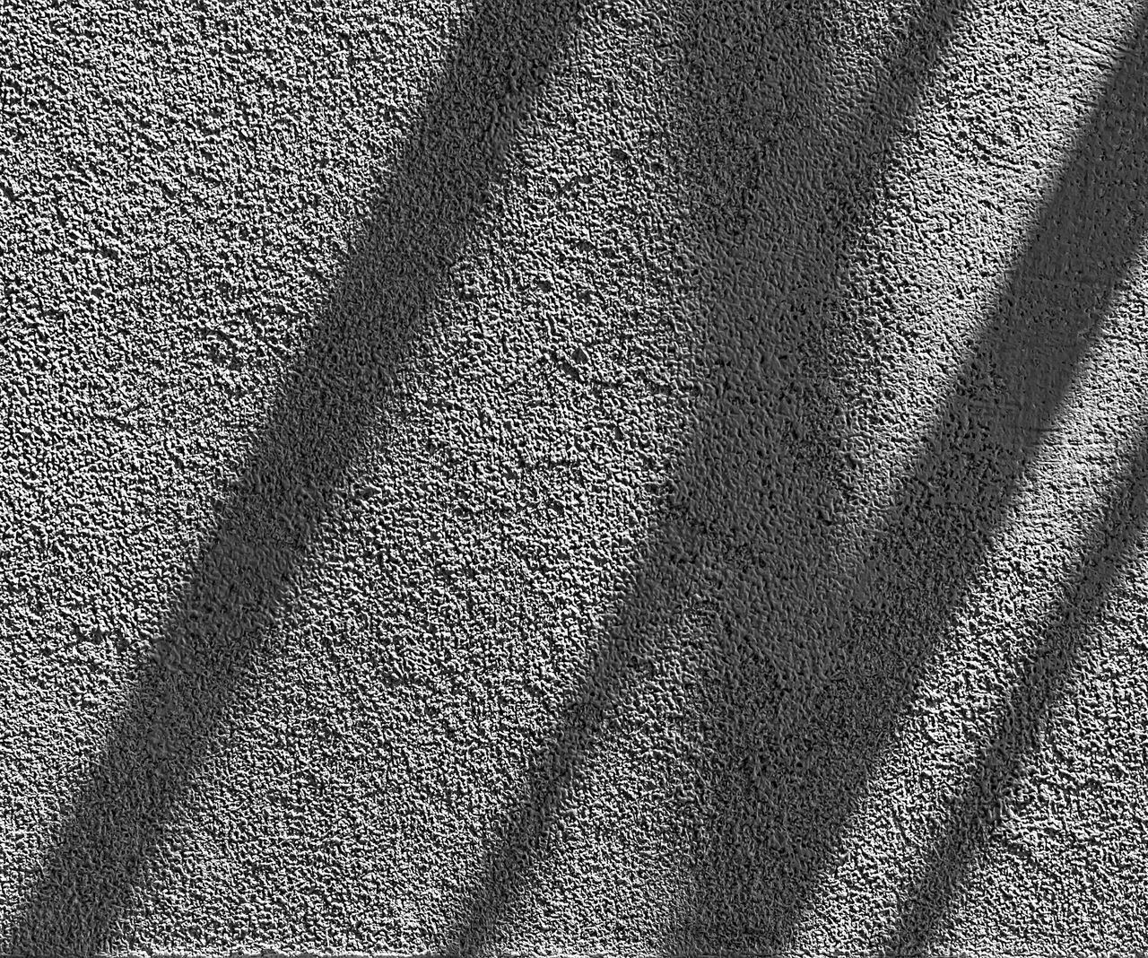 HIGH ANGLE VIEW OF SHADOW ON FOOTPATH