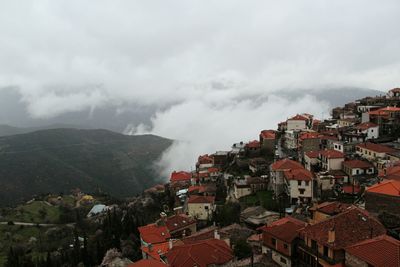 Buildings in town against sky