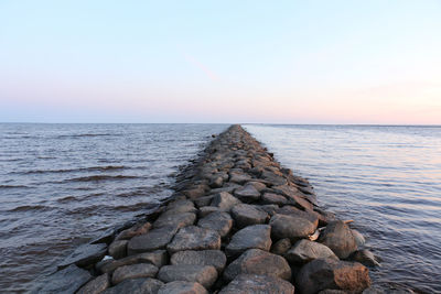 Scenic view of sea against sky during sunset