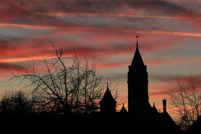Silhouette of building against sky during sunset