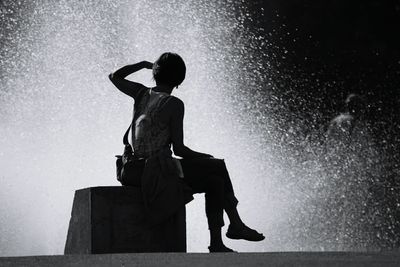 Full length of woman standing in pond