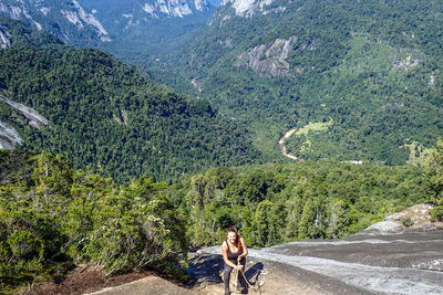 High angle view of rock climber on mountain during sunny day