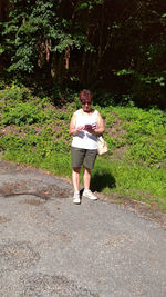 Full length of young man standing on street