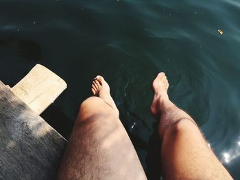 Low section of man legs in water