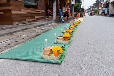 Row of religious offerings outside temple