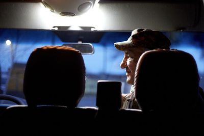 Rear view of woman sitting in bus