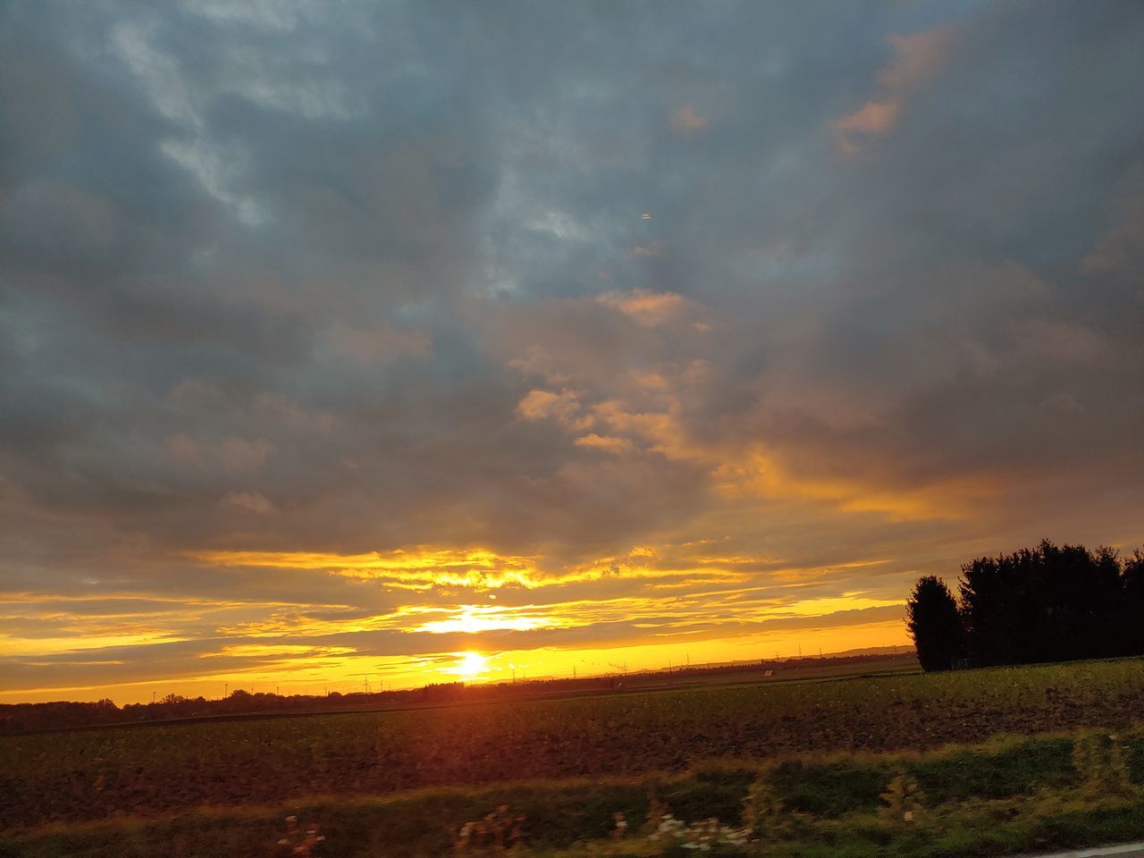 sky, cloud - sky, sunset, beauty in nature, scenics - nature, tranquility, tranquil scene, orange color, land, environment, nature, landscape, no people, non-urban scene, idyllic, tree, dramatic sky, plant, field, outdoors