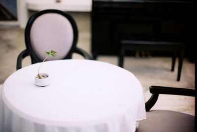 Close-up of empty chair on table at home