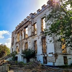 Low angle view of old building against sky