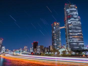 Illuminated buildings in city at night
