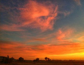 Scenic view of dramatic sky during sunset