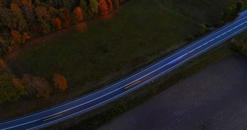 High angle view of road amidst trees during autumn