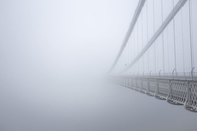 Suspension bridge in foggy weather