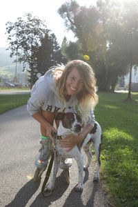 Woman with dog on road