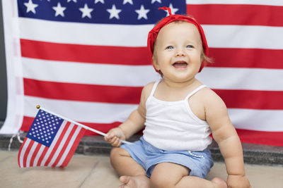 Portrait of boy with american flag