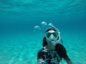 Portrait of woman swimming in sea