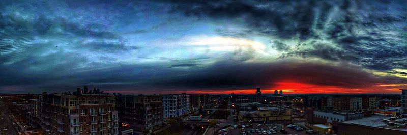 City against cloudy sky at sunset