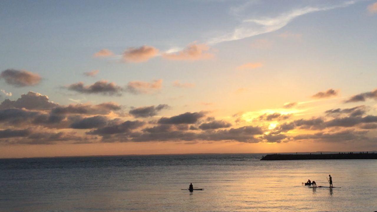 sea, horizon over water, water, sunset, sky, scenics, tranquil scene, tranquility, beauty in nature, cloud - sky, nature, nautical vessel, idyllic, waterfront, orange color, cloud, silhouette, boat, transportation, cloudy