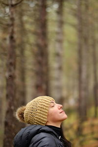 Portrait of young woman looking away