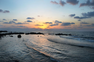 Scenic view of calm sea at sunset