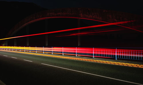 Light trails on bridge at night