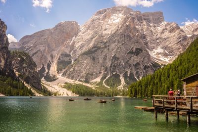 Scenic view of lake and mountains against sky