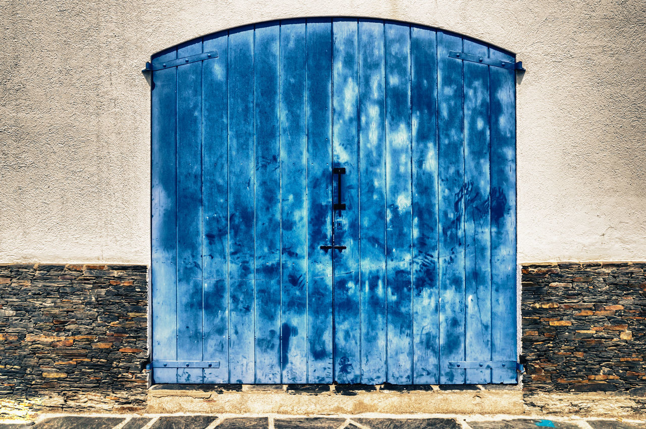 BLUE METAL DOOR OF BUILDING