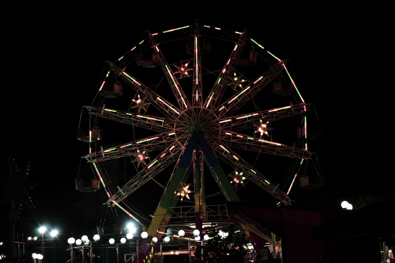 ferris wheel, amusement park ride, arts culture and entertainment, amusement park, night, illuminated, recreation, sky, traveling carnival, enjoyment, carnival, leisure activity, fun, architecture, low angle view, outdoors, nature, crowd, celebration, built structure, circle, park, group of people