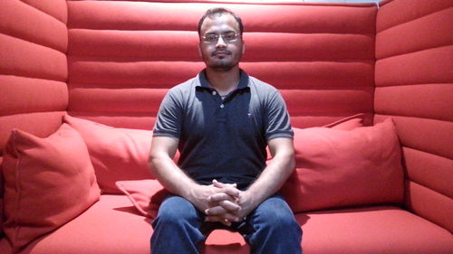 Portrait of a young man sitting outdoors