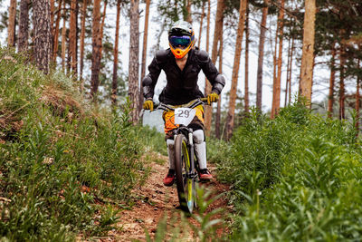 Man riding bicycle on field