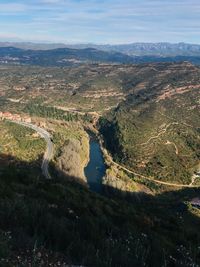 High angle view of river amidst landscape against sky