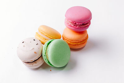 Close-up of multi colored candies against white background