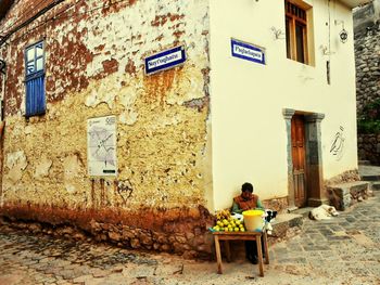 People sitting in front of building