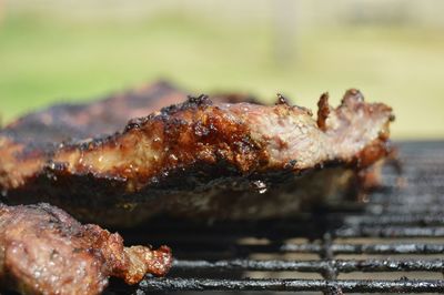 Close-up of meat on grill