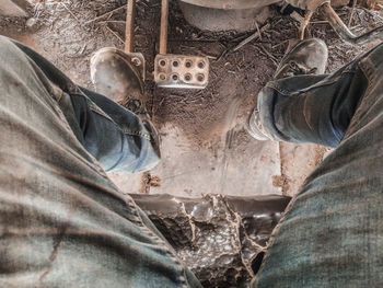 Low section of man standing on floor